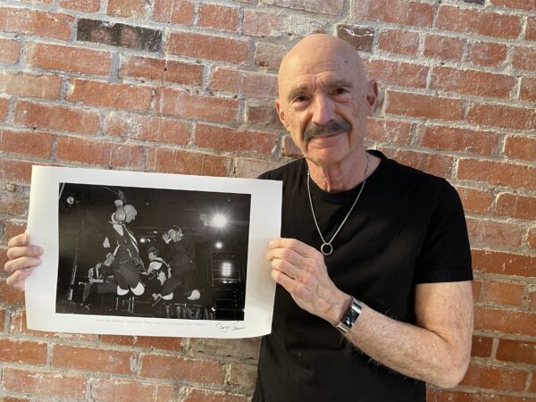 Tony Levin showing his photo of Peter Gabriel Band, 1982