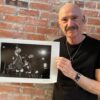 Tony Levin showing his photo of Peter Gabriel Band, 1982