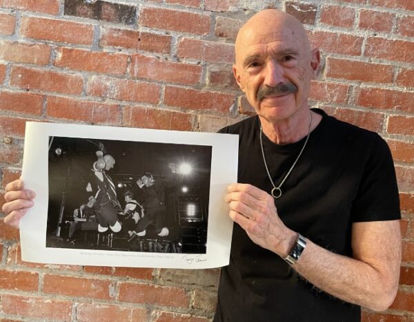 Tony Levin showing his photo of Peter Gabriel Band, 1982