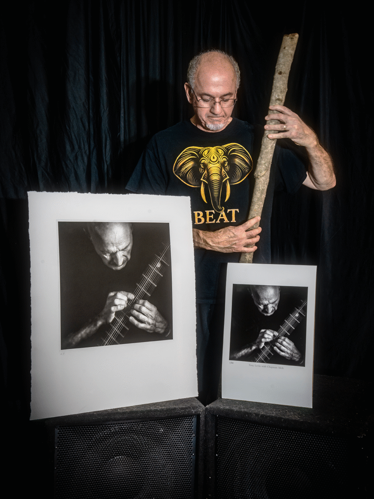Jerry LoFaro with prints of his photo "Tony Levin with Chapman Stick".